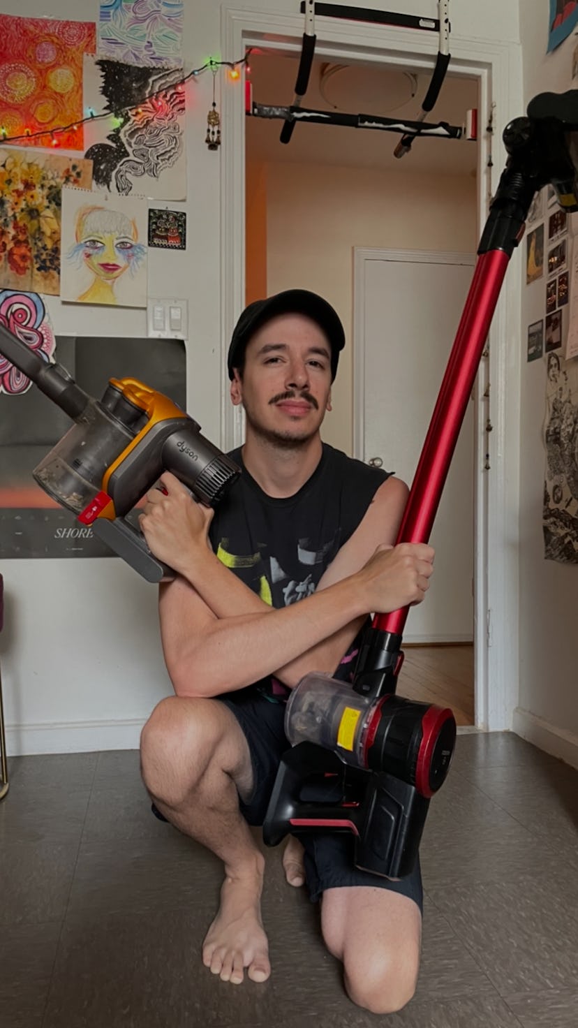 James Pero (the author) holding two vacuums