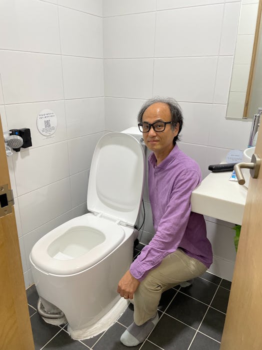 researcher Jaeweon Cho standing next to part of the BeeVi eco-friendly toilet system at UNIST