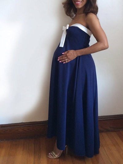 navy blue strapless maternity dress with white trim on sweetheart neck