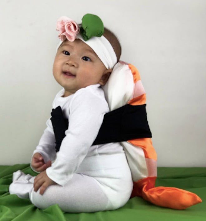 Baby dressed as a piece shrimp sushi