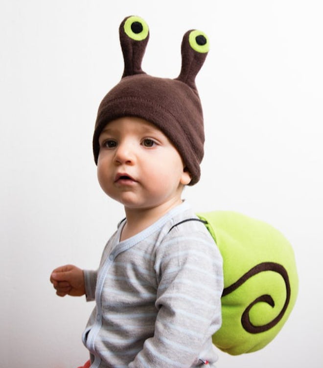 Baby dressed in a snail costume