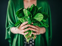 woman holding edible plants