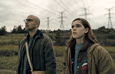 Stanley Tucci and Kiernan Shipka stand side by side in The Silence.
