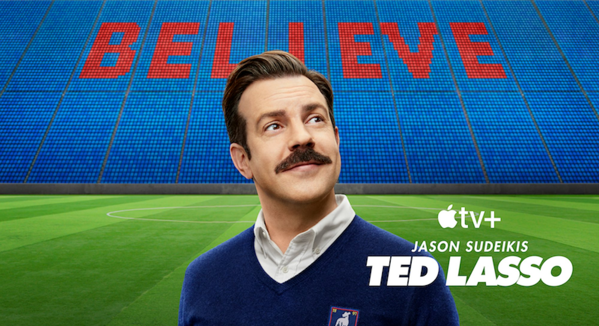 Ted Lasso standing at a soccer stadium