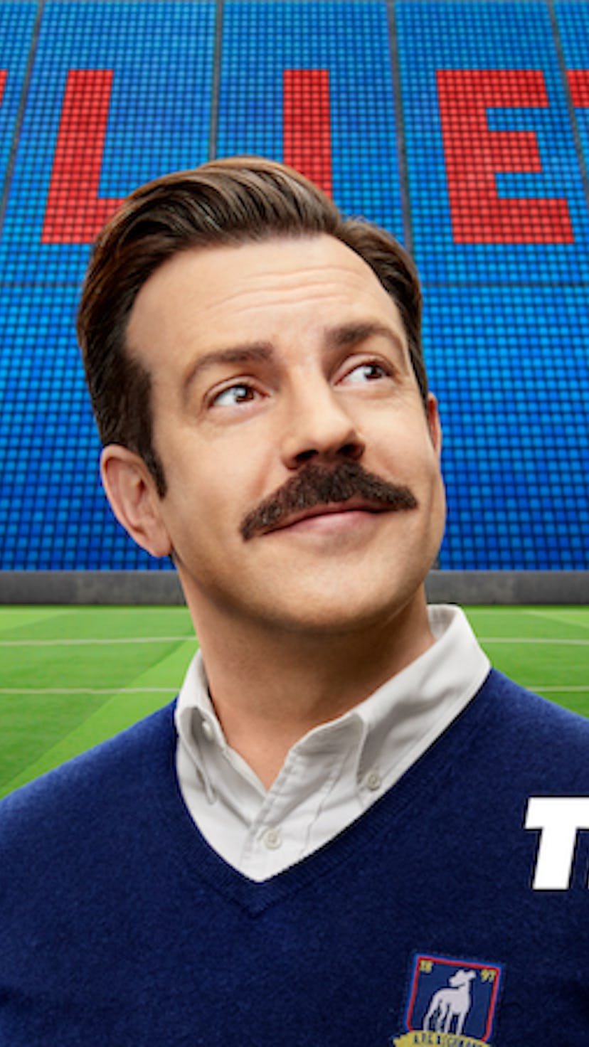 Ted Lasso standing at a soccer stadium