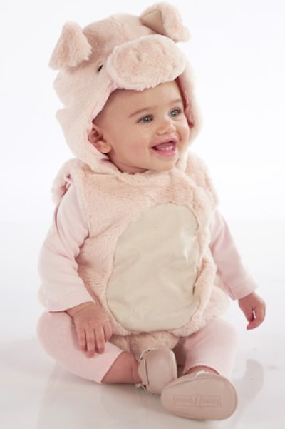 Baby wearing a pig costume