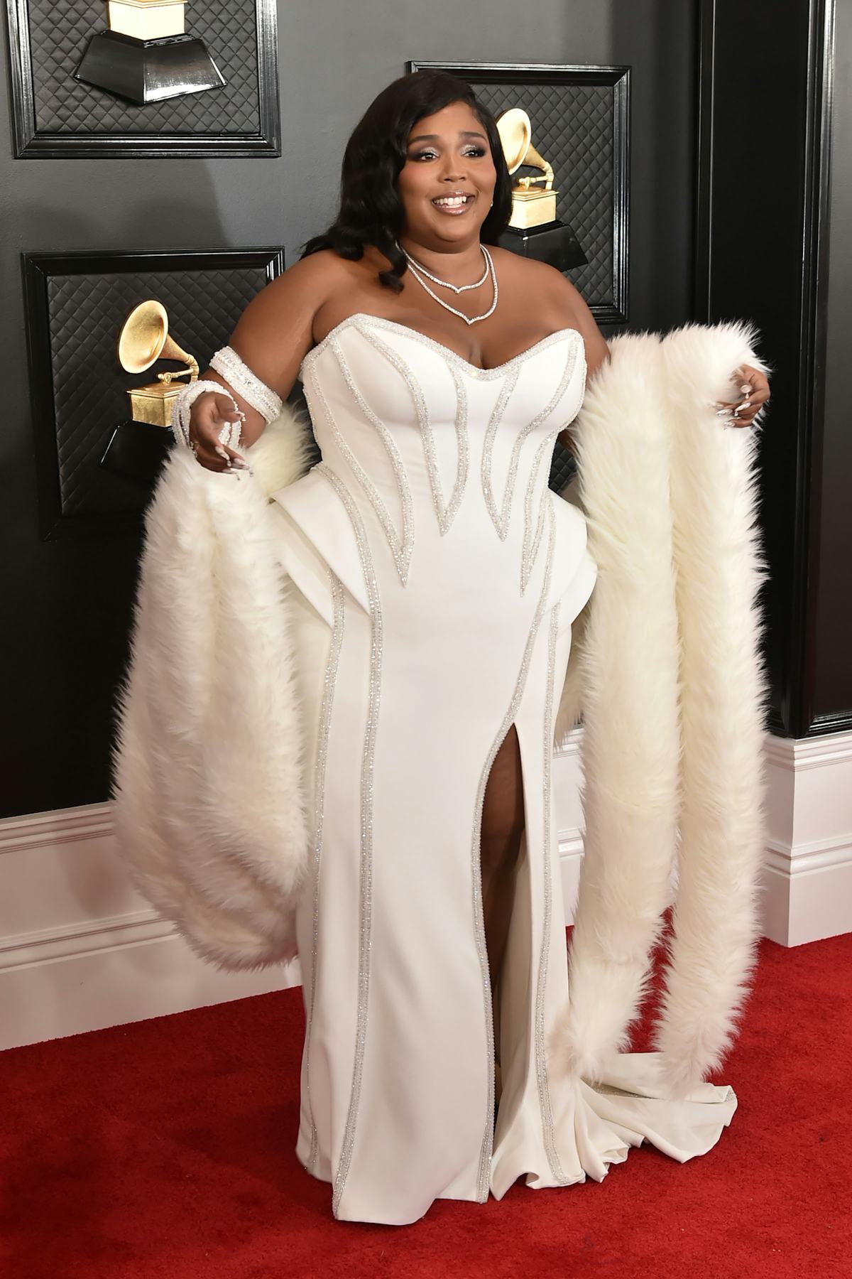 Lizzo in white Versace dress. 