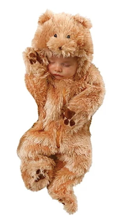 Newborn in a bear costume