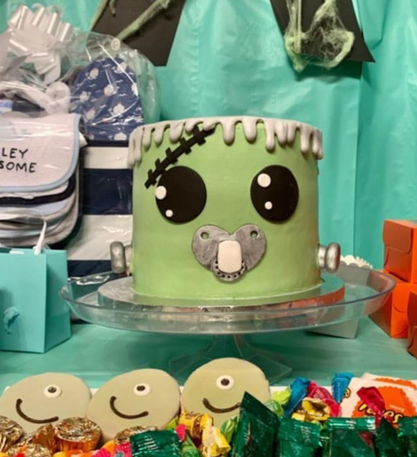Cake decorated to look like Frankenstein head with pacifier