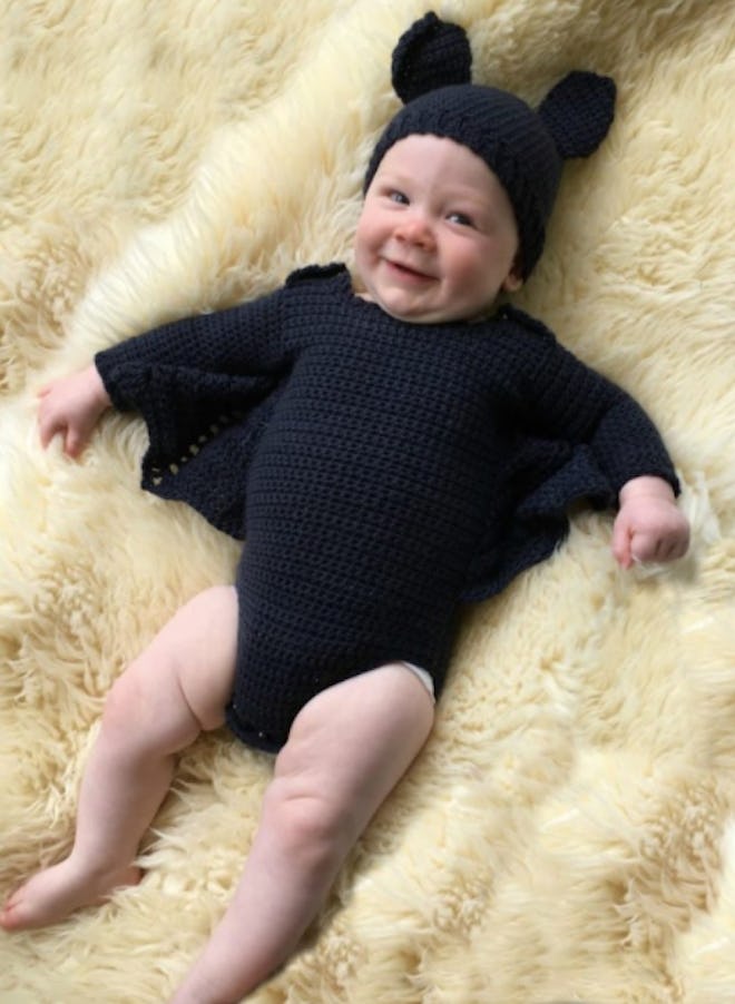 Baby dressed in a bat costume