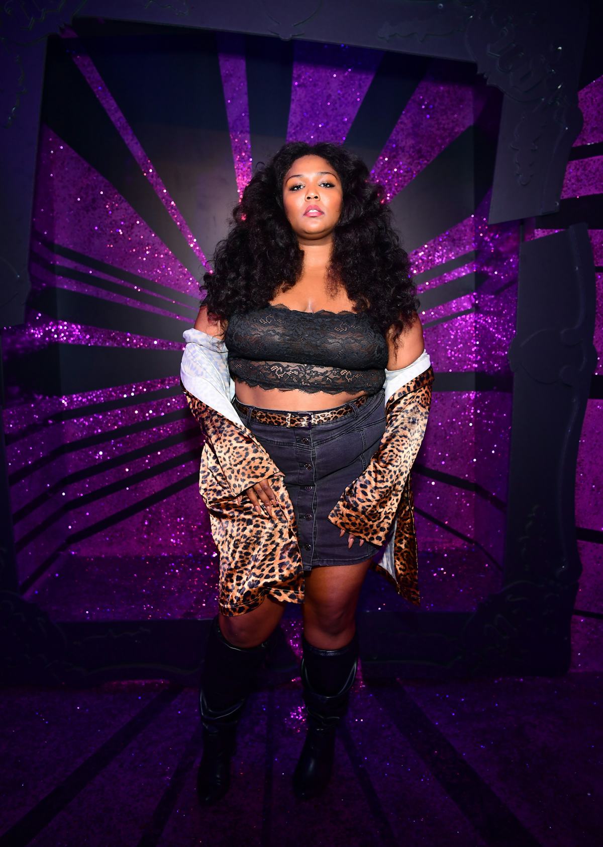 Lizzo in black and leopard print separates. 