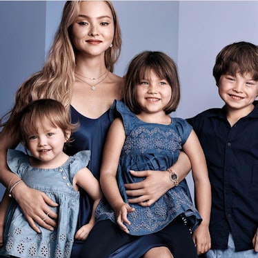 Mom and supermodel, Devon Aoki, posing with her three children.