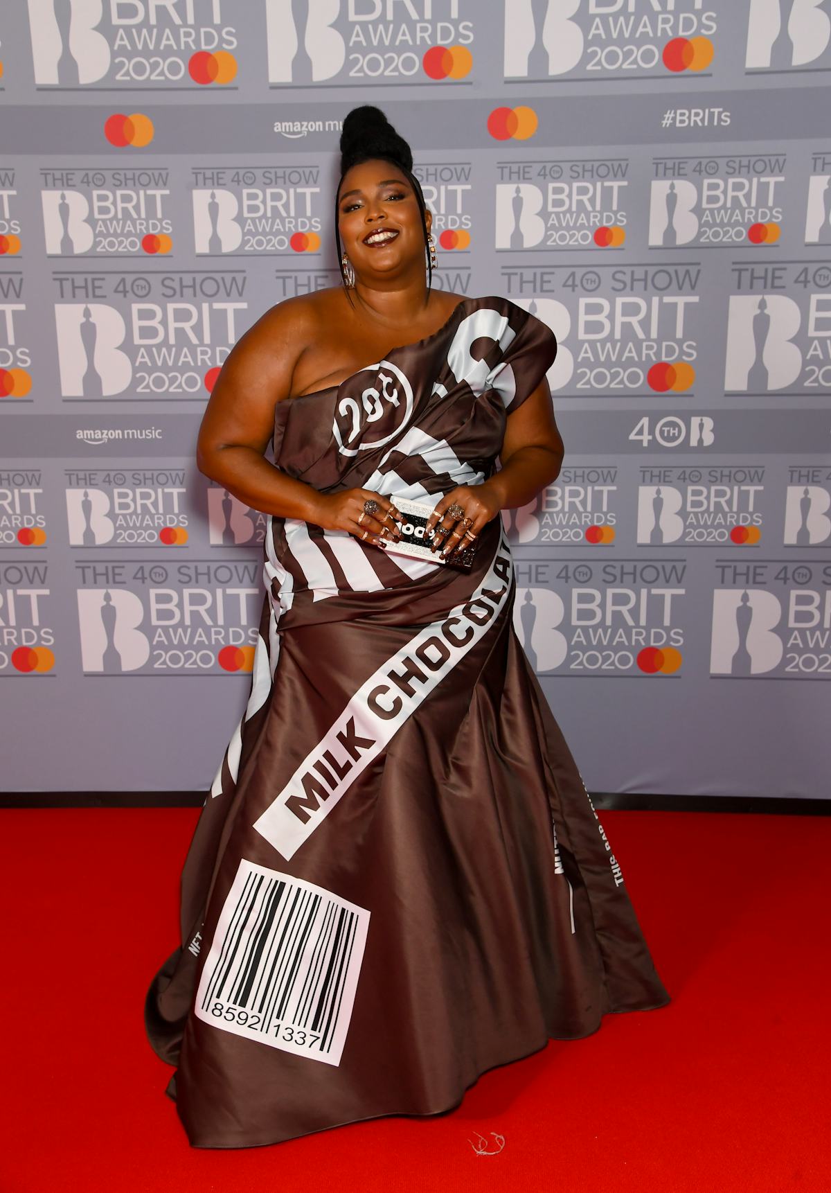 Lizzo in a chocolate bar-like dress. 