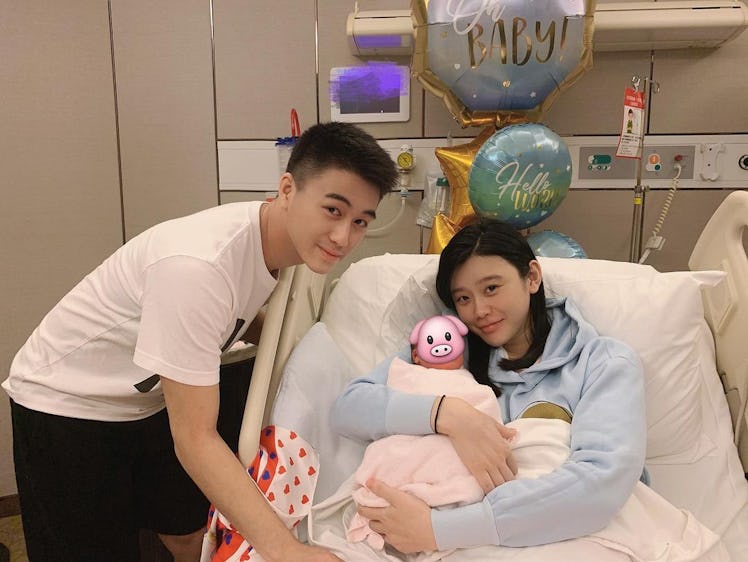 Ming Xi, mom and supermodel, in hospital with her husband after giving birth to her son Ronaldo.