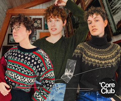 Three male models in a cottage house posing in warm and cozy sweaters.