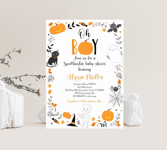 Halloween baby shower invitation; "Oh Boy!" with black cats, pumpkins, and ghosts bordering the invi...
