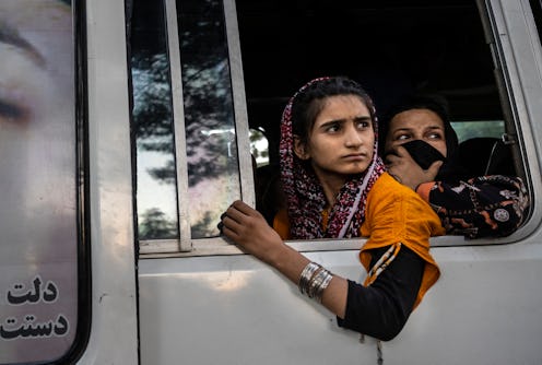 Displaced Afghans from the northern provinces are evacuated from a makeshift IDP camp in Share-e-Naw...