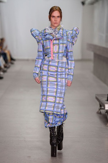 A model in a light blue checkered dress by Frederik Taus