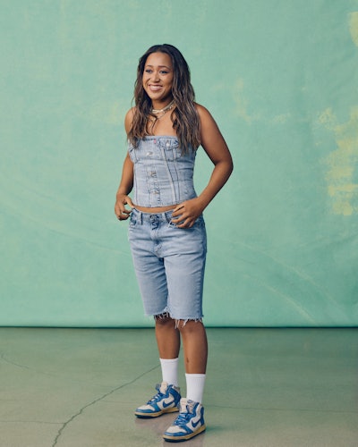 Tennis star Naomi Osaka wears trucker jacket buster and knee-length shorts in the campaign for her L...