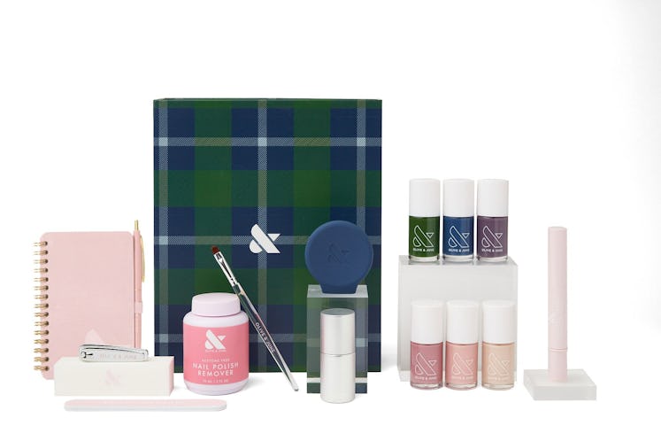 The Olive and June Fall 2021 Collection including six nail shades, manicure tools, and a plaid box.