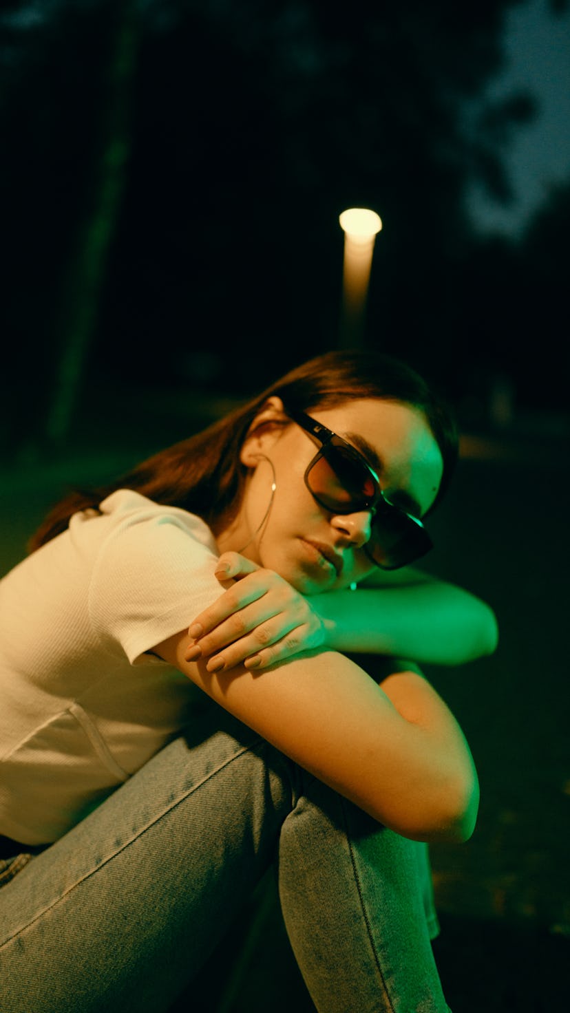 Young woman with sunglasses during Uranus retrograde 2021.