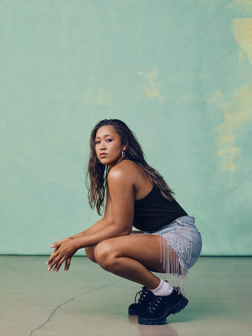 Tennis star Naomi Osaka wears crystal-embellished short denim shorts the campaign for her Levi's col...