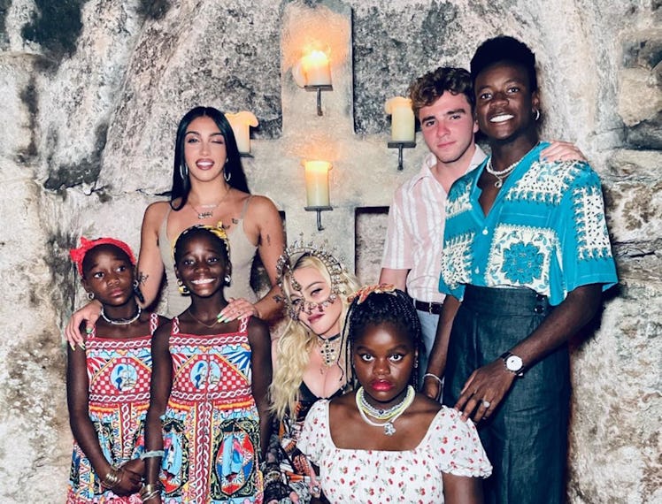 Madonna with her six well-dressed children.