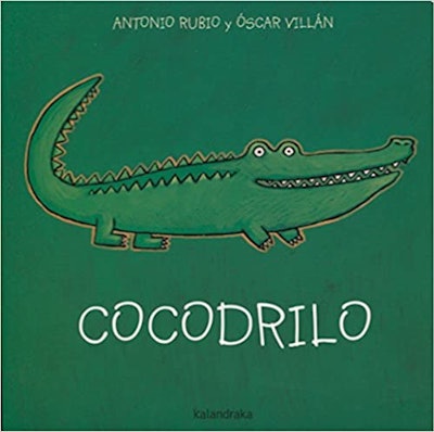photo of the cover of Spanish children's book, Cocodrilo, which features a cartoon crocodile on a gr...