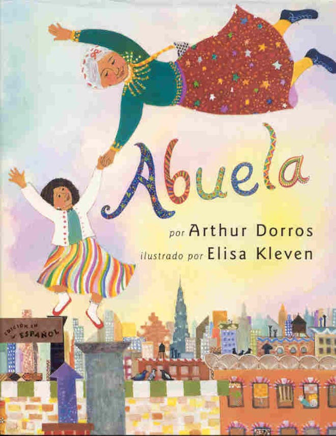 cover of Spanish children's book Abuela, featuring a drawing of a grandmother and granddaughter flyi...