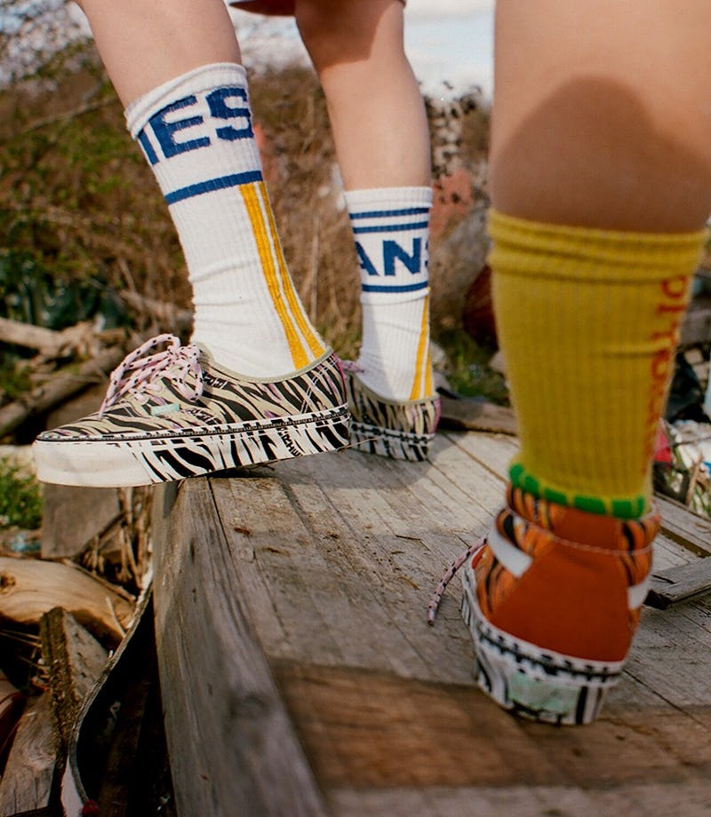 Man with sneakers on a rock
