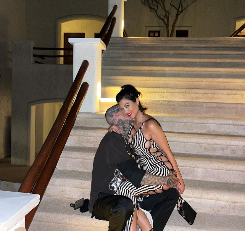 Kourtney Kardashian and Travis Barker take a photo together.