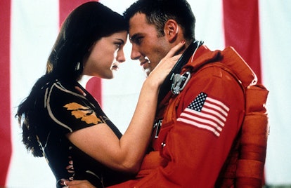 Liv Tyler and Ben Affleck embrace in a scene from the film 'Armageddon.'