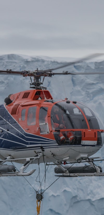 Geophysical measurements with a magnetometer being towed with RV Polarstern's board helicopter.