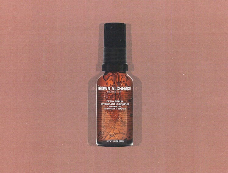 a translucent brown glass bottle of Grown Alchemist Detox serum