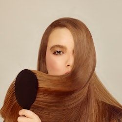 Woman brushing hair