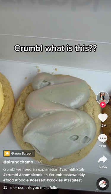 Gray icing sits on Crumbl Cookies in a TikTok review. 
