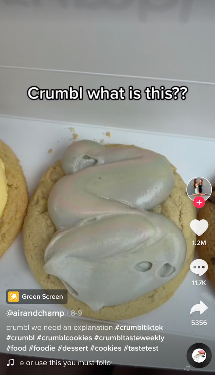 Gray icing sits on Crumbl Cookies in a TikTok review. 
