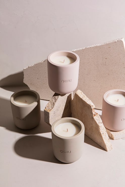 Ouai candles in Melrose Place and North Bondi arranged around rocks