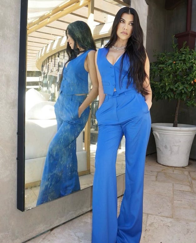 Kourtney Kardashian wears a blue jumpsuit in her Instagram.