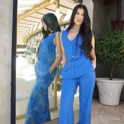 Kourtney Kardashian wears a blue jumpsuit in her Instagram.