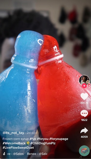 A man squeezes frozen corn syrup out of a bottle for TikTok. 
