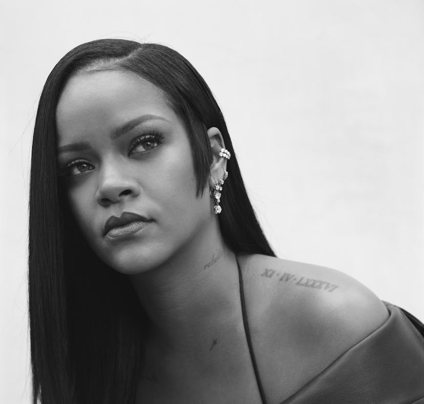 A promotional, black-and-white portrait of Rihanna with an asymmetrical side burn haircut for Fenty ...