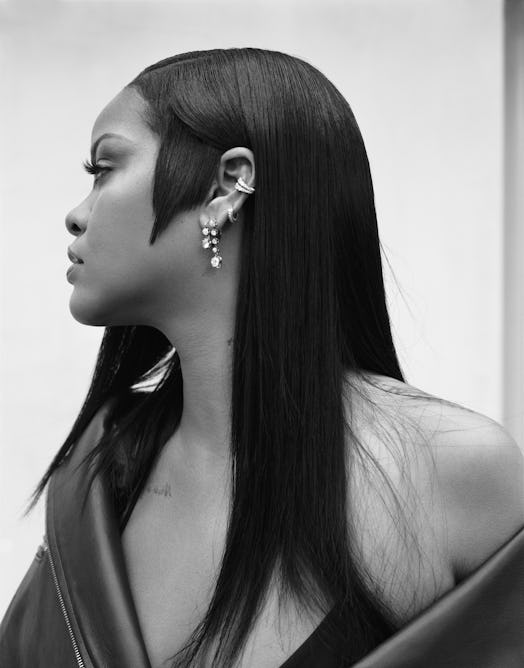 A black and white promotional image of Rihanna with blunt cut sideburns for Fenty Beauty's new fragr...