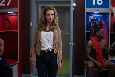 Keeley Jones (Juno Temple) whose zodiac sign is Taurus, standing in the locker room in Ted Lasso, a ...