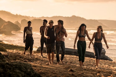 Carlacia Grant with the 'Outer Banks' cast on a beach in Season 2