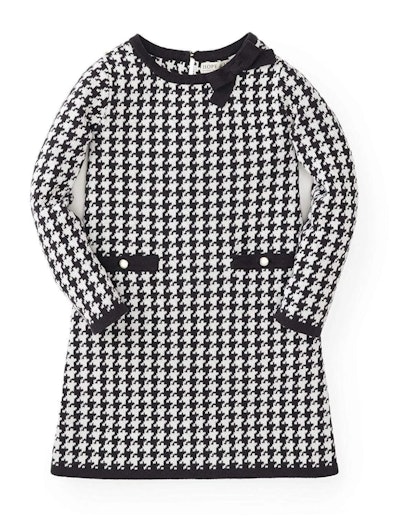 Image of kid-size black-and-white print sweater dress with front pocket detail.