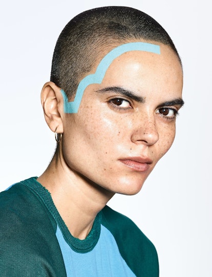 Portrait of a model with a shaved head and clear skin
