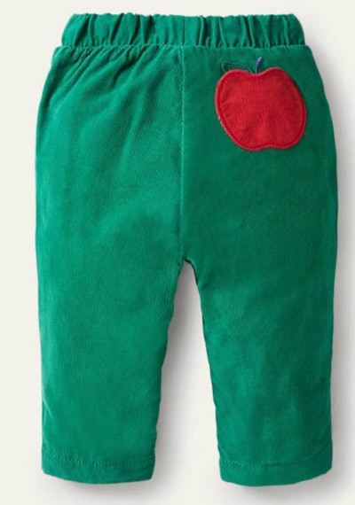 Image of toddler-size green corduroy pants with apple on the back.