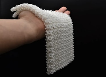 Resembling a weighted crocheted blanket when “fluid,” this material is capable of lifting 50x its ow...