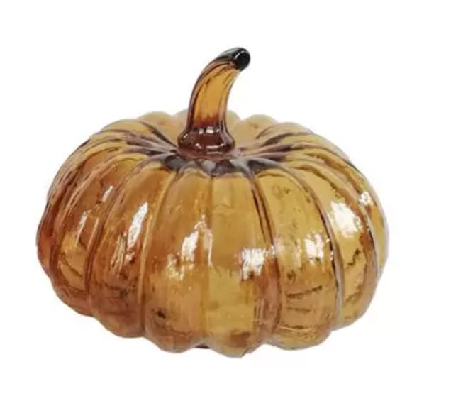 Image of small decorative glass pumpkin with interior lights.